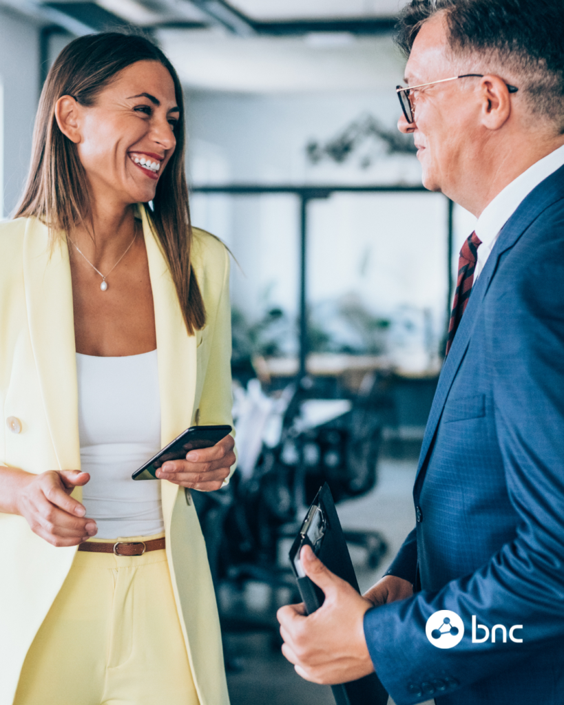 two business people speaking in office
